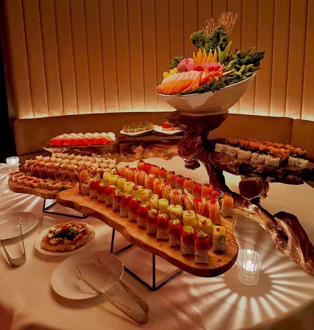 Luxury sushi catering display with premium assorted rolls and garnishes for a New York event